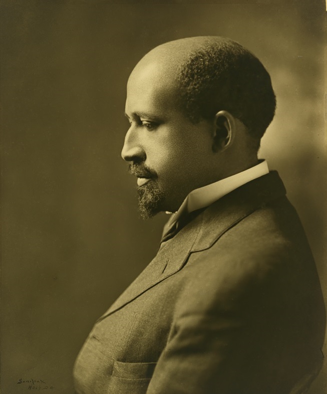 Sepia toned photograph of a man in a suit in profile