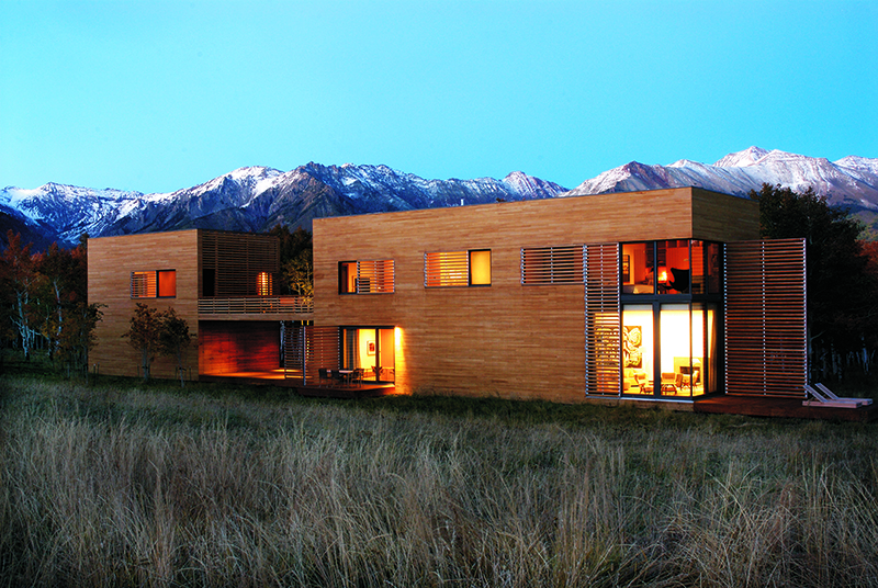 Box-like house in a mountainous landscape