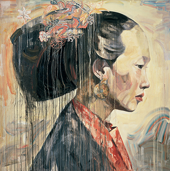 Profile view of an Asian woman with her hair in a large bun
