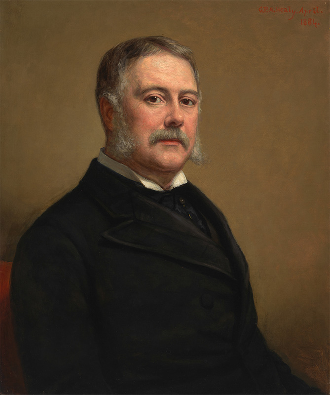 waist length portrait of a man in a black suit