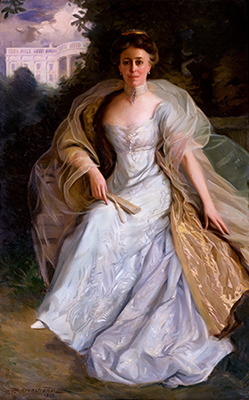 Woman in a long elegant dress in front of the White House