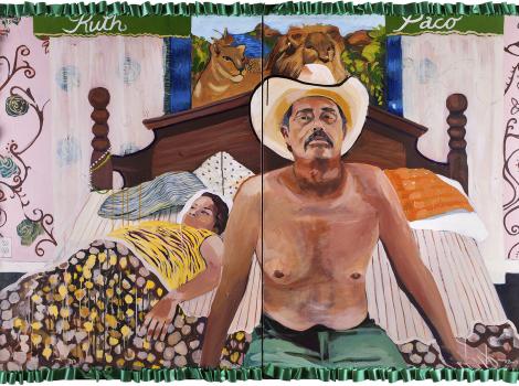 Shirtless man in a cowboy hat sitting on a bed