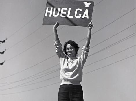 photo of a woman holding a protest sign