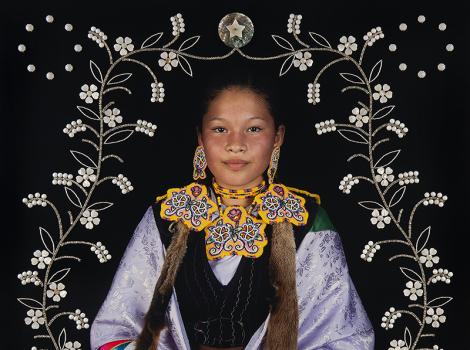 Young Native American woman in colorful dress