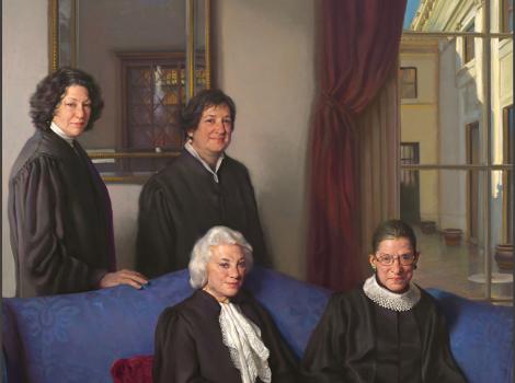 four female justices, two seated on a couch and two standing behind