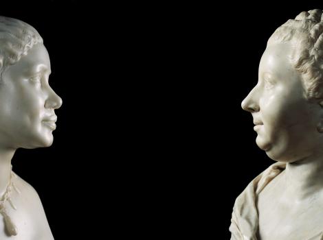 Marble sculpture of an African American woman and an older white woman facing each other
