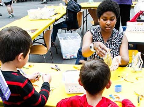 A Smithsonian volunteer doing arts activities with kids