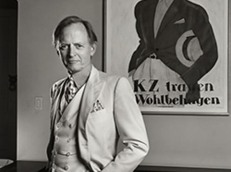 Black and white portrait of a man in a white suit